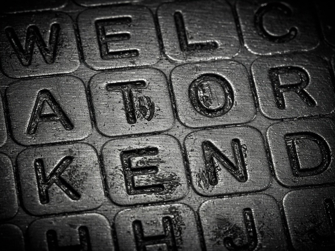 Steel seed-phrase backup plate with engraved letter grid